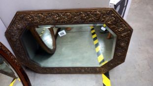 A 1930's pressed brass framed bevel edge mirror, COLLECT ONLY