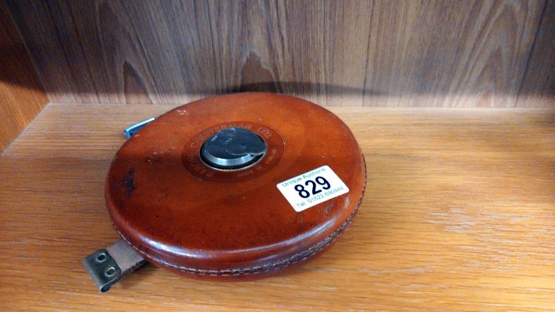 A leather cased Rabone Chesterman tape measure