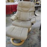 A cream leather reclining chair with matching stool, COLLECT ONLY.