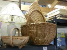 A vintage basket and a wooden gardener's basket.