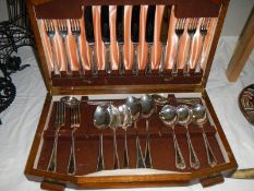 A cased part canteen of cutlery, (missing 3 forks and a spoon).