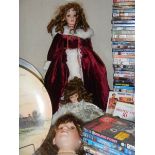 Two bisque porcelain headed dolls and a bisque porcelain dolls head.