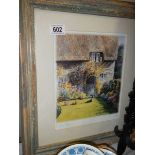 A framed and glazed signed print entitles A Cottage Garden. COLLECT ONLY.