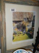 A framed and glazed signed print entitles A Cottage Garden. COLLECT ONLY.