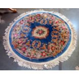 A circular rug - 153cm diameter including tassels COLLECT ONLY