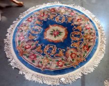 A circular rug - 153cm diameter including tassels COLLECT ONLY