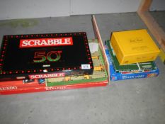 A quantity of board games including 50th anniversary scrabble, completeness unknown.