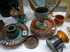 Two vintage terracotta ashtrays and one other.