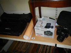 A Canon EOS 350D digital camera, bag, accessories and photo cube.