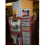 A Sony music system on stand (no remote) and a quantity of CD's COLLECT ONLY.