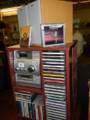 A Sony music system on stand (no remote) and a quantity of CD's COLLECT ONLY.