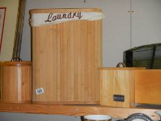 A bamboo laundry bin, & wooden biscuit jar etc.