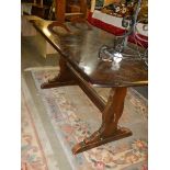 An Ercol dark oak dining table, COLLECT ONLY.