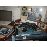 Two shelves of old photographs.