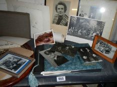 Two shelves of old photographs.