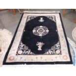 A black & beige rug - 230cm x 143cm (including tassels) COLLECT ONLY