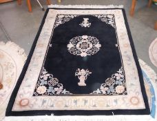 A black & beige rug - 230cm x 143cm (including tassels) COLLECT ONLY