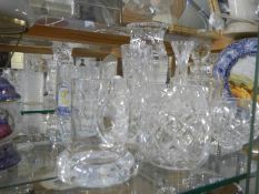 A mixed lot of glass ware including decanters, vases, tankards etc.,