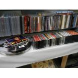 A quantity of DVD's, CD's and cassette tapes.
