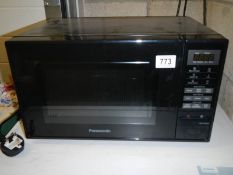 A black Panasonic microwave oven COLLECT ONLY.