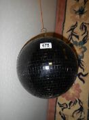 An unusual black disco glitter ball.