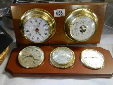 A ship's style wall clock with barometer on mahogany back and one other.