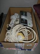 A box of extension leads.