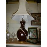 A brown ceramic table lamp.