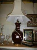A brown ceramic table lamp.