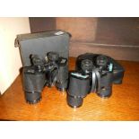 Two cased sets of binoculars.