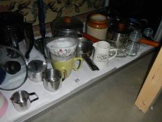 A mixed lot of kitchen ware including saucepans, jugs etc.,