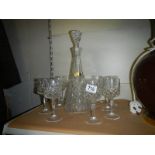 A Julia lead crystal decanter and ten glasses.