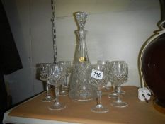 A Julia lead crystal decanter and ten glasses.