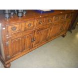 A good quality oak sideboard with linenfold panel doors, COLLECT ONLY.