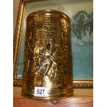 A vintage pressed brass log bin.