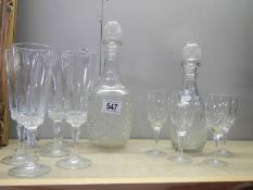 Two glass decanters and a quantity of glasses,. COLLECT ONLY.