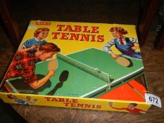 A vintage boxed Merit table tennis set.