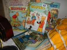 A quantity of Rupert annuals and Giles books.