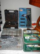 A quantity of cordless screwdriver and attachments,