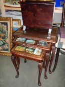 A nest of three glass top tables and a magazine rack. COLLECT ONLY.