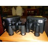 Two cases sets of binoculars.