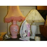Two ceramic table lamps and an electric iron.