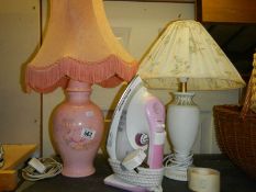 Two ceramic table lamps and an electric iron.