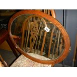 A 1930's oval oak framed mirror. COLLECT ONLY.