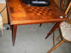 A mahogany side table with chess board top, COLLECT ONLY.