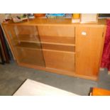 A 1950's oak book case with cupboard, COLLECT ONLY.