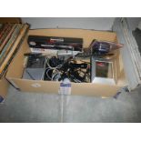 A box of assorted electrical items including microphones, radio etc.,