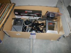 A box of assorted electrical items including microphones, radio etc.,