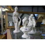 A white ceramic Grecian style bust and two figures.