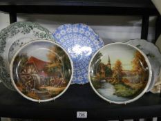 Two country scene collector's plates, two other plates and a flan dish.